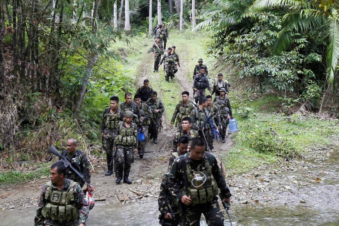 Filipino soldiers are patrol in the town of Ibanga, Bohol island, Philippines. Photo: EPA