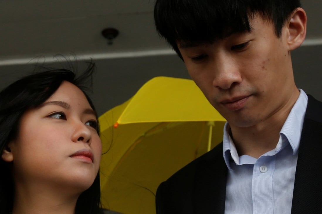 Disqualified pro-independence legislators Yau Wai-ching and Sixtus Baggio Leung, seen outside a court last month, have been charged with unlawful assembly and forceful entry over an attempt to barge into a Legislative Council meeting last November. Photo: Reuters