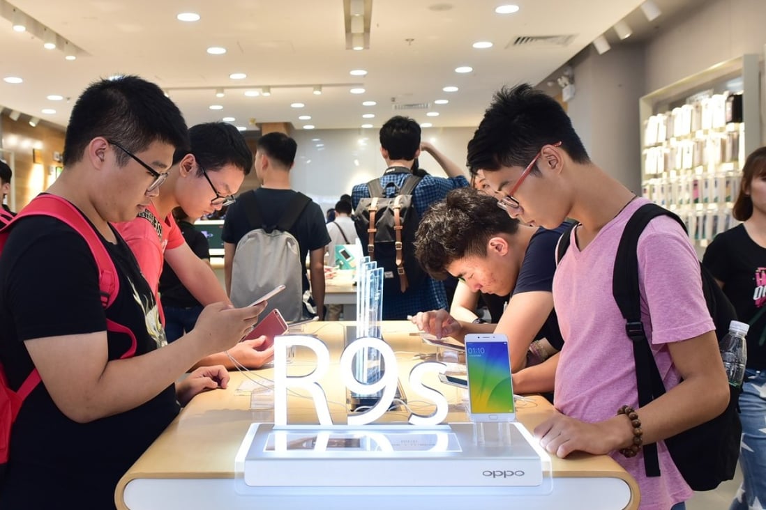 An Oppo experience store in Guangzhou, where users can try out smartphones. Oppo’s R9s shipped 8.9 million units for third place worldwide in the first quarter. Photo: Handout