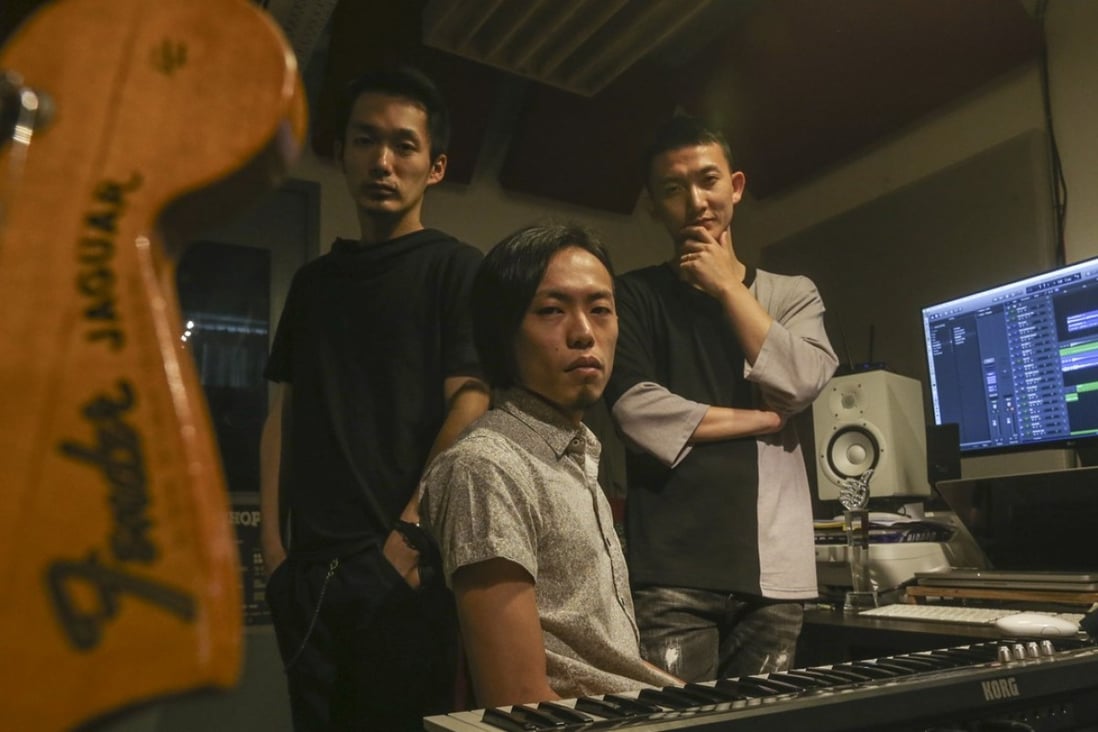 From left: Yuh Egami, Mike Orange and Ricky Hu work on Carmen. Photo: K.Y. Cheng