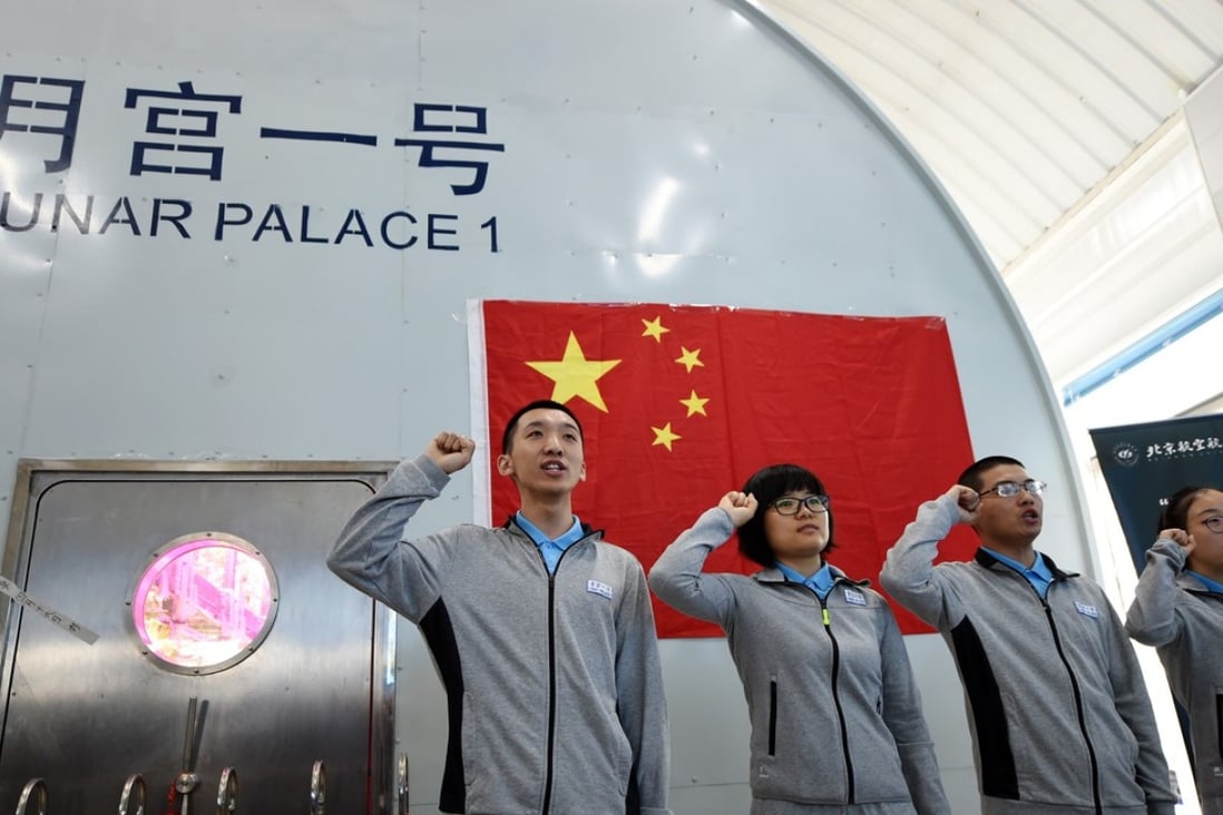 Four volunteers take an oath before starting their stay in the Lunar Palace 1. Photo: Xinhua