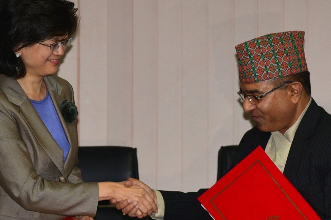 Nepal's Foreign Secretary Shankar Das Bairagi and China's Ambassador to Nepal, Yu Hong (L), exchange documents during a signing ceremony relating to the One Belt One Road initiative in Kathmandu. Photo: AFP