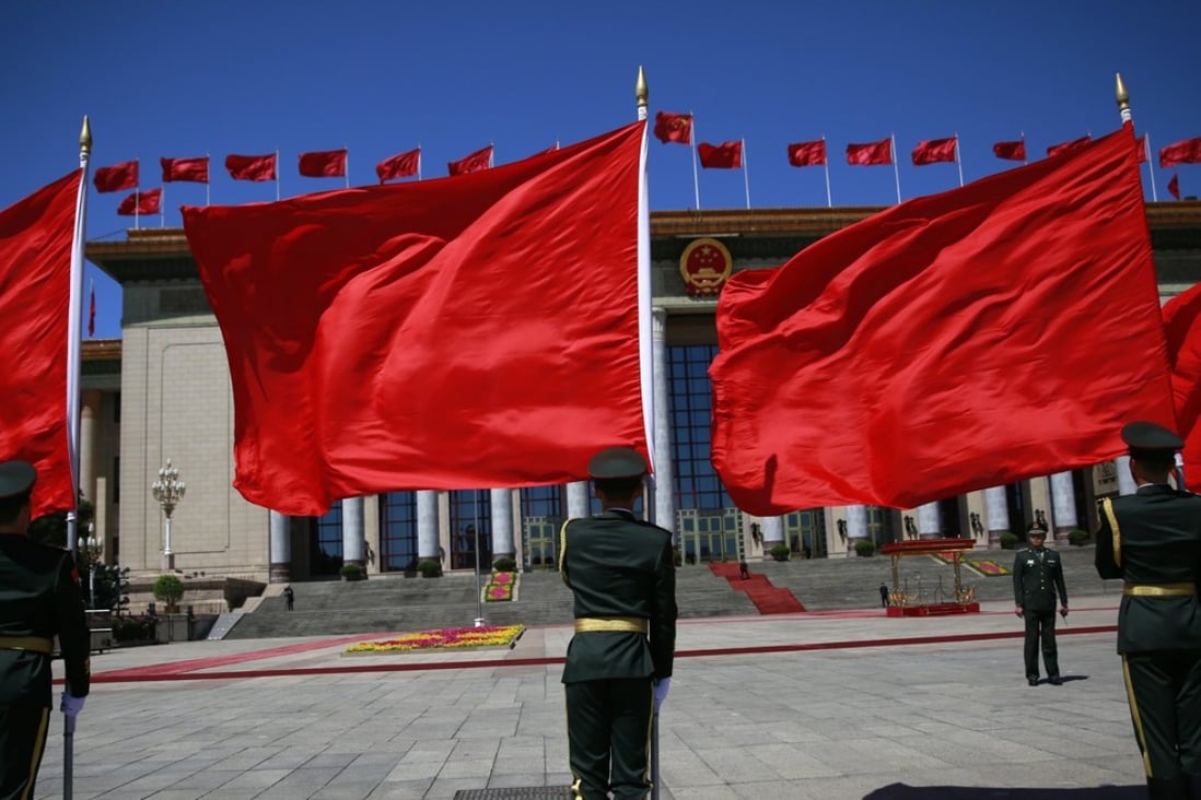Honour guards hold flags at the Great Hall of the People in Beijing on Saturday as foreign delegates begin arriving for the belt and road forum in Beijing on Sunday and Monday. Photo: EPA