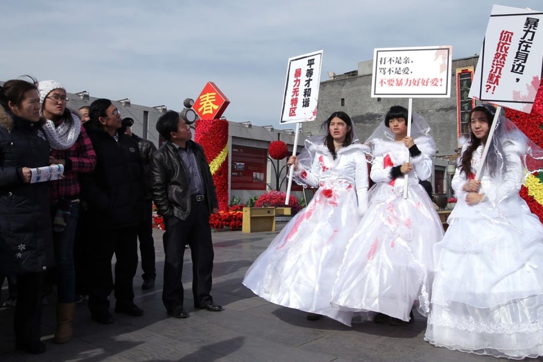 Li Tingting (centre), campaigns in Beijing on Valentine’s Day 2012 against domestic violence. Photo: Simon Song