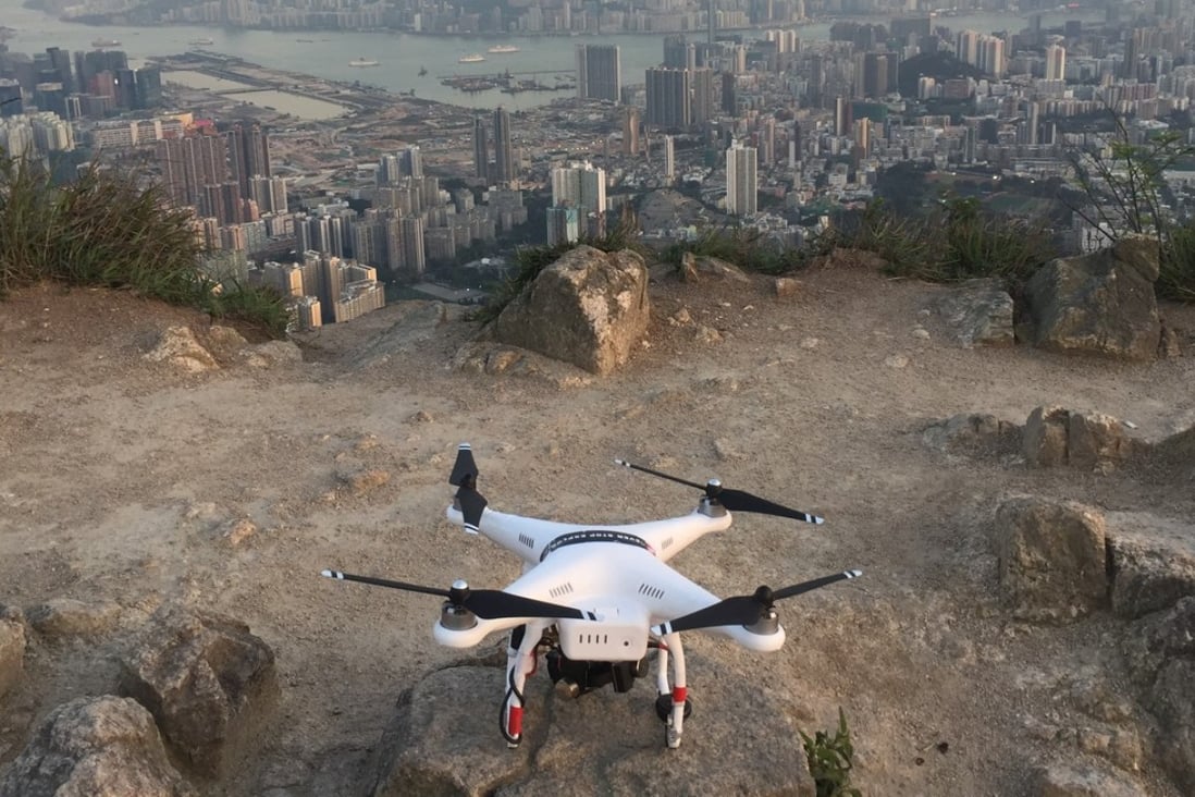 A DJI Phantom 2 drone, ready for lift off, overlooking Kowloon in Hong Kong. Some of its larger commercial models can cost in excess of US$100,000. Photo: Edwin Lee