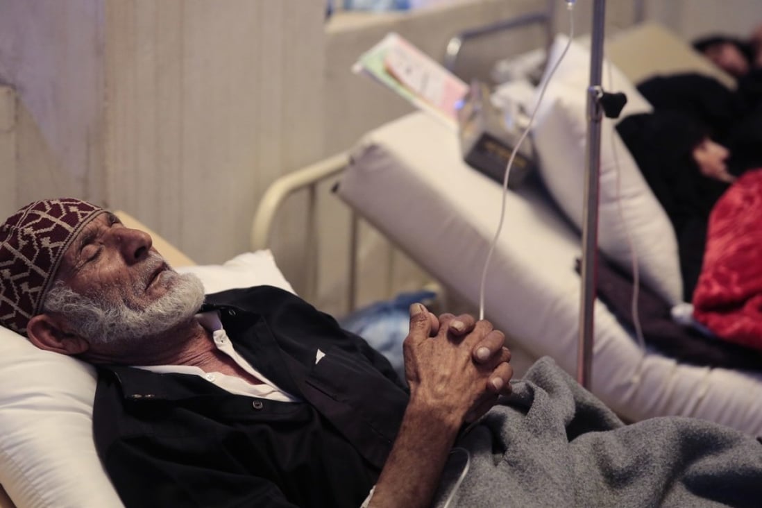 An elderly man is treated for suspected cholera at a hospital in Sanaa, Yemen, Monday. At least 180 people may have died from the disease over the past few weeks. Photo: AP