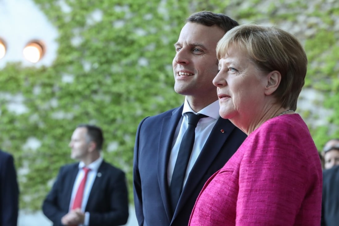 German Chancellor Angela Merkel (R) poses with visiting French President Emmanuel Macron in Berlin as both leaders pledge to push for a new Europe and to beat off the challenge of populists on the continent. Photo: Xinhua