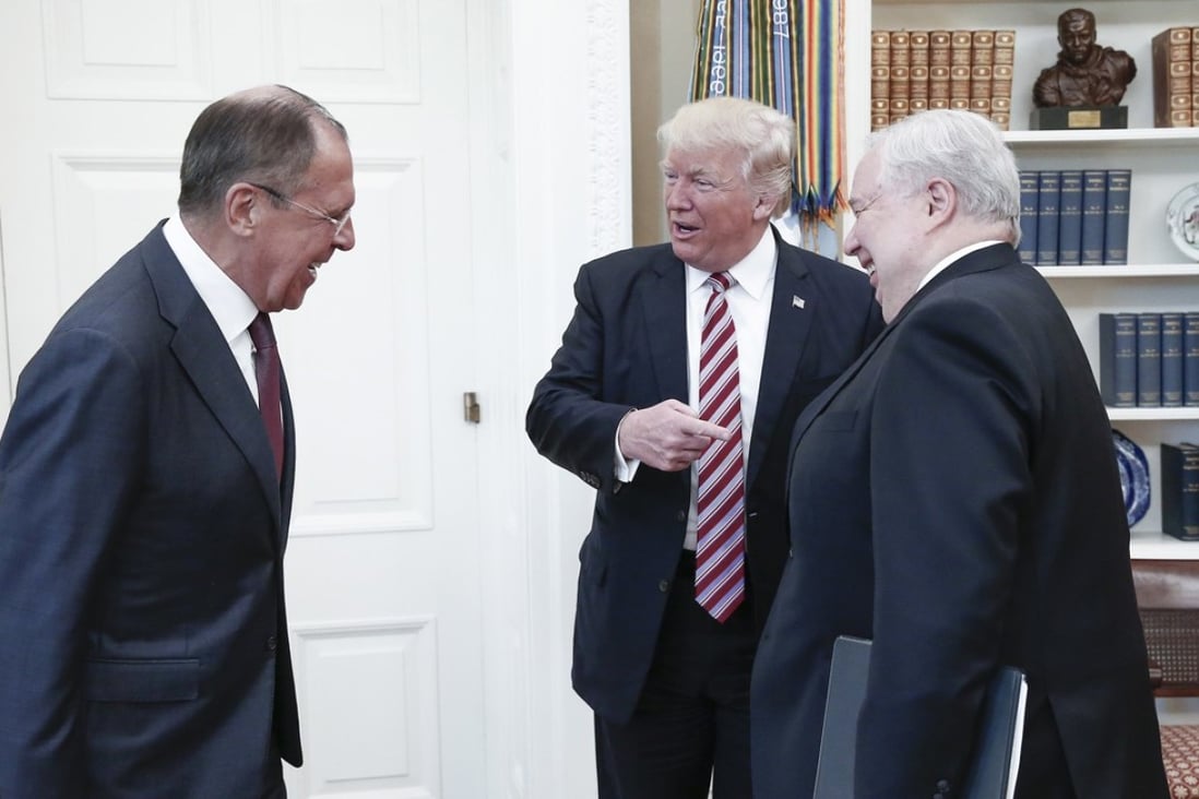 From left, Russia's Foreign Minister Sergei Lavrov, US President Donald Trump, and Russian Ambassador to the United States Sergei Kislyak talk during a meeting in the Oval Office at the White House on Wednesday, May 10. Photo: TNS