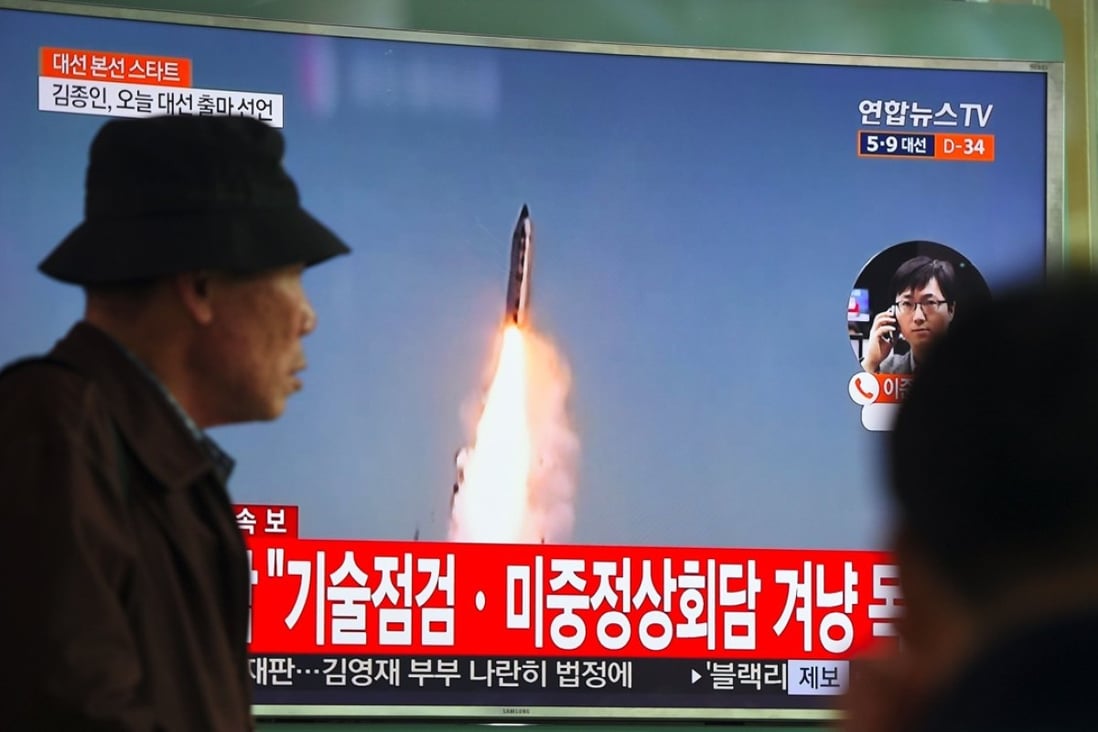 Television footage of a North Korean missile launch, at a railway station in Seoul. Photo: AFP