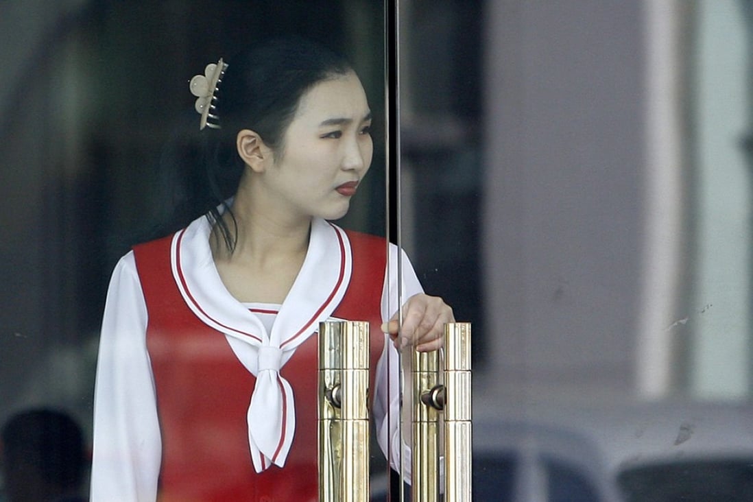 A North Korean waitress at a restaurant in Dandong, China. North Korean restaurants overseas are a vital source of foreign money for Pyongyang. Photo: AFP