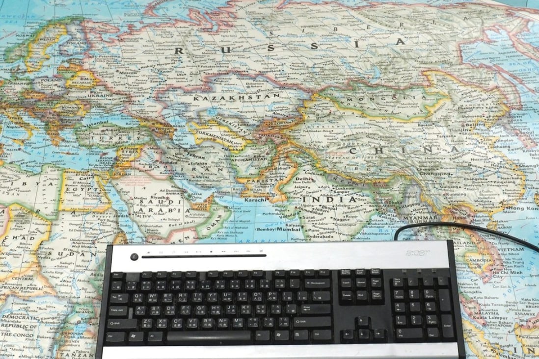 A computer keyboard sits on a world map as French researchers may have found a way to retrieve some files in in a 'Ransomware' cyber attack that has hit computers in 99 countries. Photo: EPA