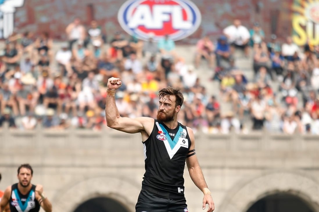 Port Adelaide’s Charlie Dixon celebrates a goal as AFL makes it official debut in China. Photos: AFL Media