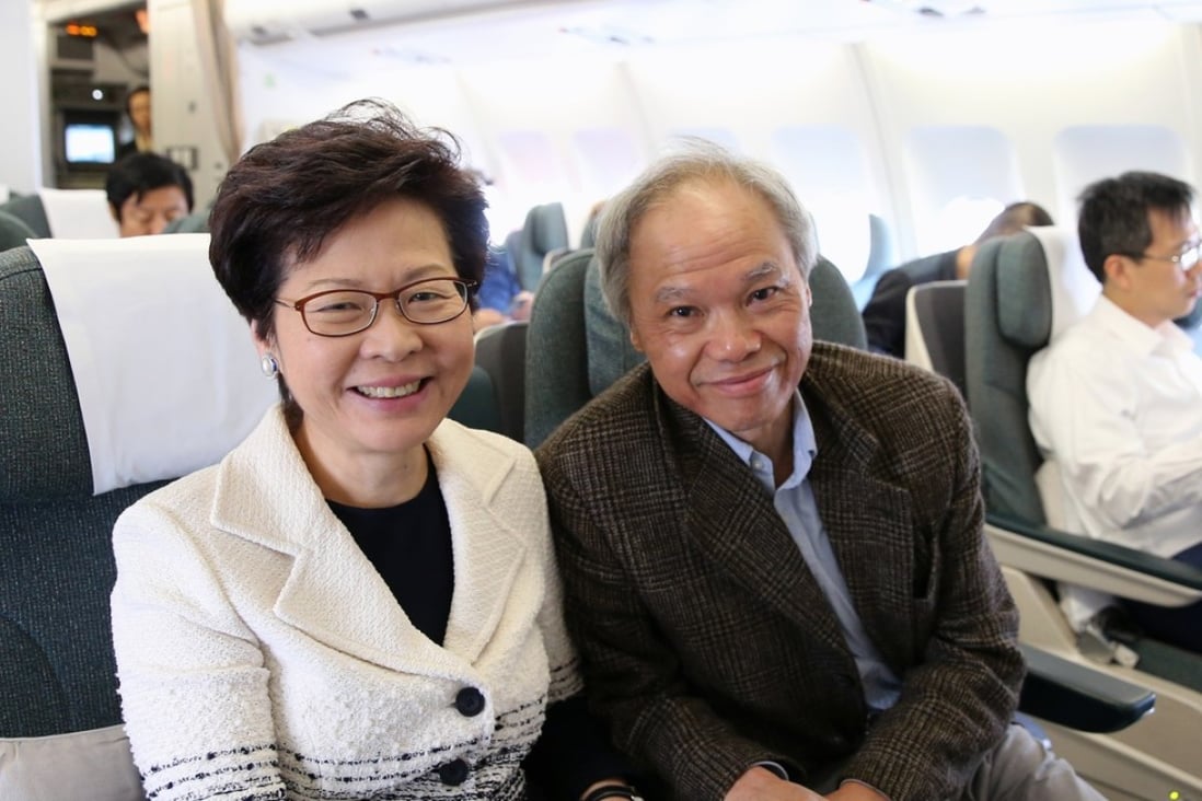 Carrie Lam with husband Lam Siu-por on a flight to Beijing. Photo: Sam Tsang