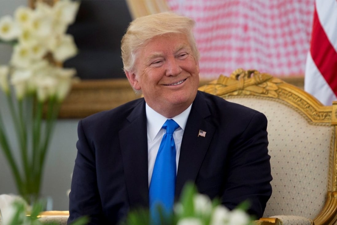 US President Donald Trump has coffee during a reception ceremony in Riyadh, Saudi Arabia, on Saturday. Close to 40 per cent of the US population still support him. How could this be so, given his frequent distortion of facts coupled with his bombastic narcissism? Photo: Saudi Royal Court handout via Reuters