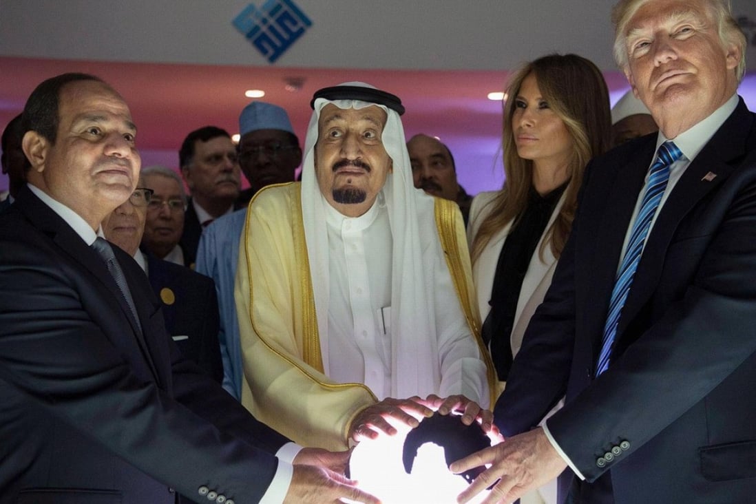 A startling photograph of Donald Trump, the Egyptian president and Saudi king placing their hands on a glowing orb at a summit in Riyadh has prompted comparisons between the US president and villains from comic books and film. Photo: EPA