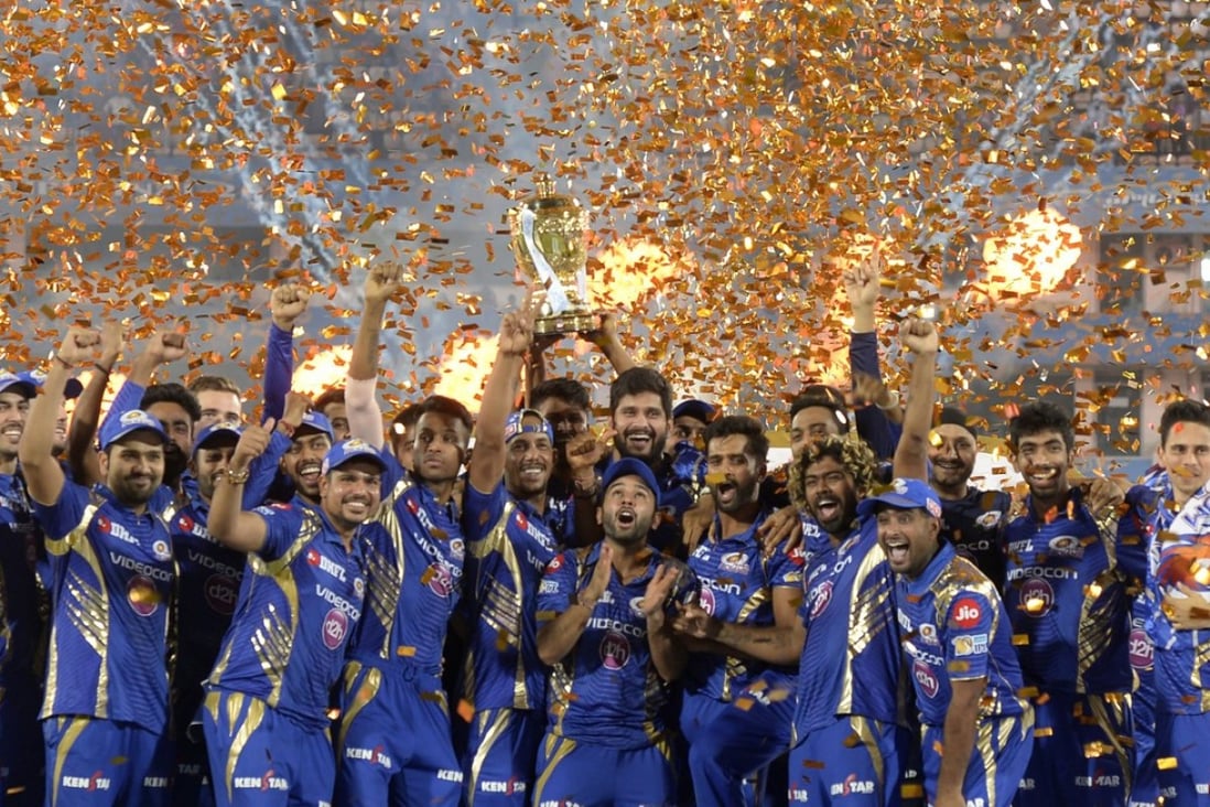 Mumbai Indians players hold the trophy as they celebrate their victory against Rising Pune Supergiant in the 2017 Indian Premier League. Photo: AFP