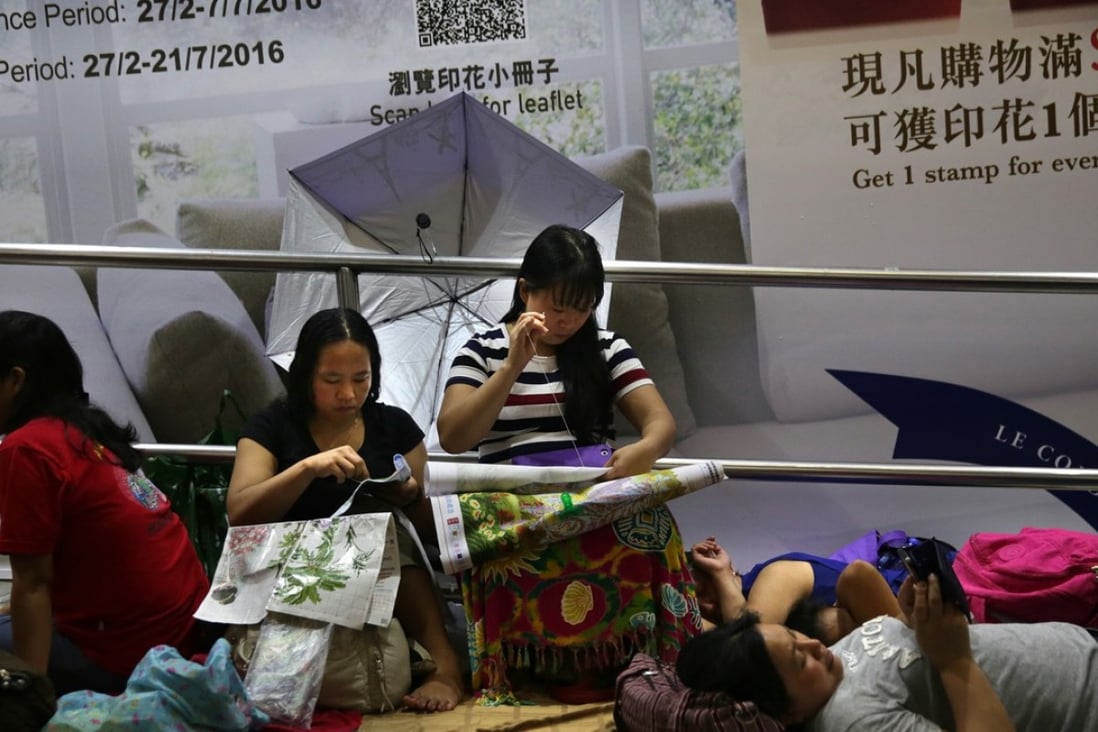 Domestic workers meet in Central on a day off in June last year. Photo: AFP