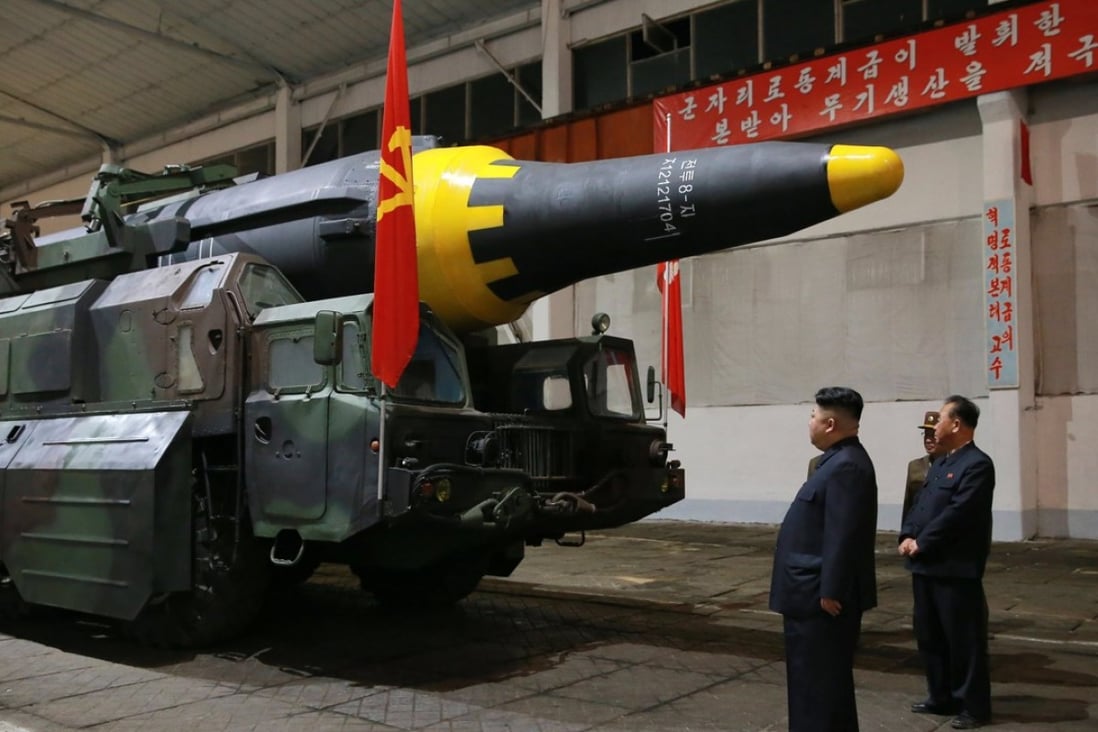 North Korean leader Kim Jong-un inspects a missile after Pyongyang said it had successfully test-fired a new ground-to-ground medium long-range strategic ballistic rocket on May 14. Photo: EPA