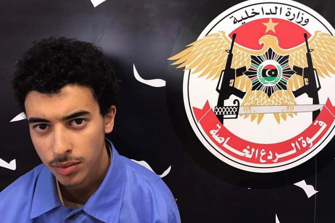 Hashim Ramadan Abedi, brother of Salman Abedi, who has been identified as the man behind the Manchester concert bombing, appears inside the Tripoli-based Special Deterrent anti-terrorism force unit after his arrest on Tuesday for alleged links to the Islamic State extremist group. The Special Deterrent Force says that Hashim confessed both he and his brother were a part of the Islamic State group and that Hashim had been aware of the details of the attack. Photo: Special Deterrent Force via AP