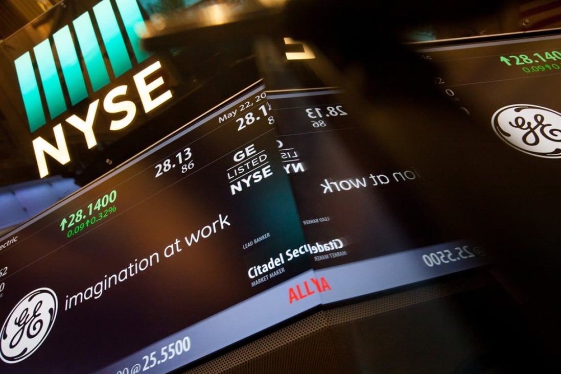 A monitor displays General Electric signage on the floor of the New York Stock Exchange (NYSE). Wall Street posted gains as the Fed minutes indicated a gradual approach to US interest rates. Photo: Bloomberg