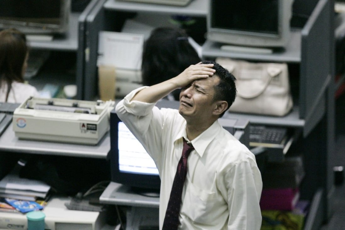 An Indonesian trader on the trading floor of the Indonesia Stock Exchange in Jakarta on Oct 8, 2008. Indonesia's benchmark stock index had plunged 10 per cent that day on fears about the global financial crisis, prompting officials to halt trading. Photo: AP