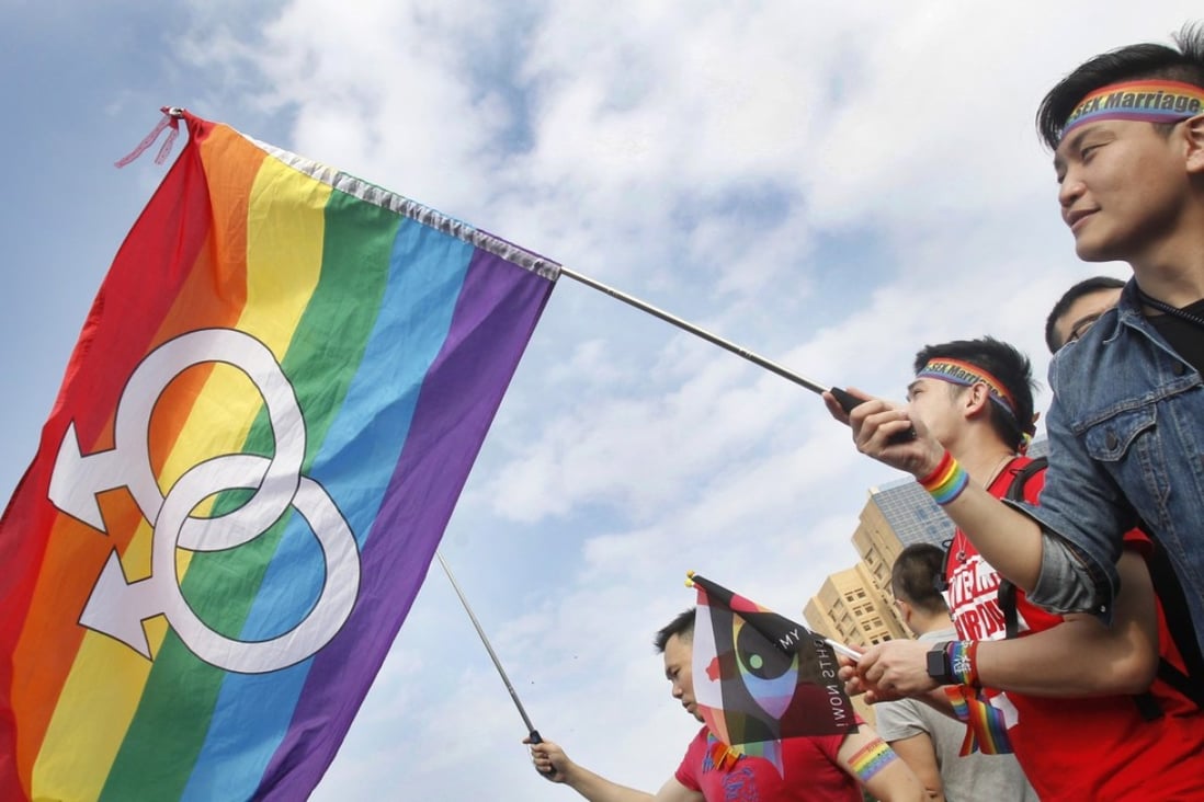 Supporters of LGBT and human rights wave rainbow flags in 2016 during a rally supporting a proposal to allow same-sex marriage in Taipei. Photo: AP