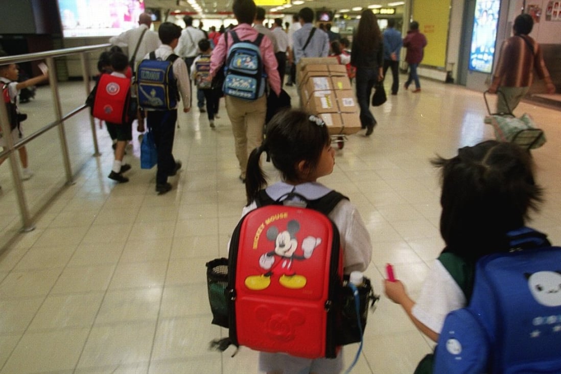 Young children cross into Hong Kong to go to school. Photo: David Wong