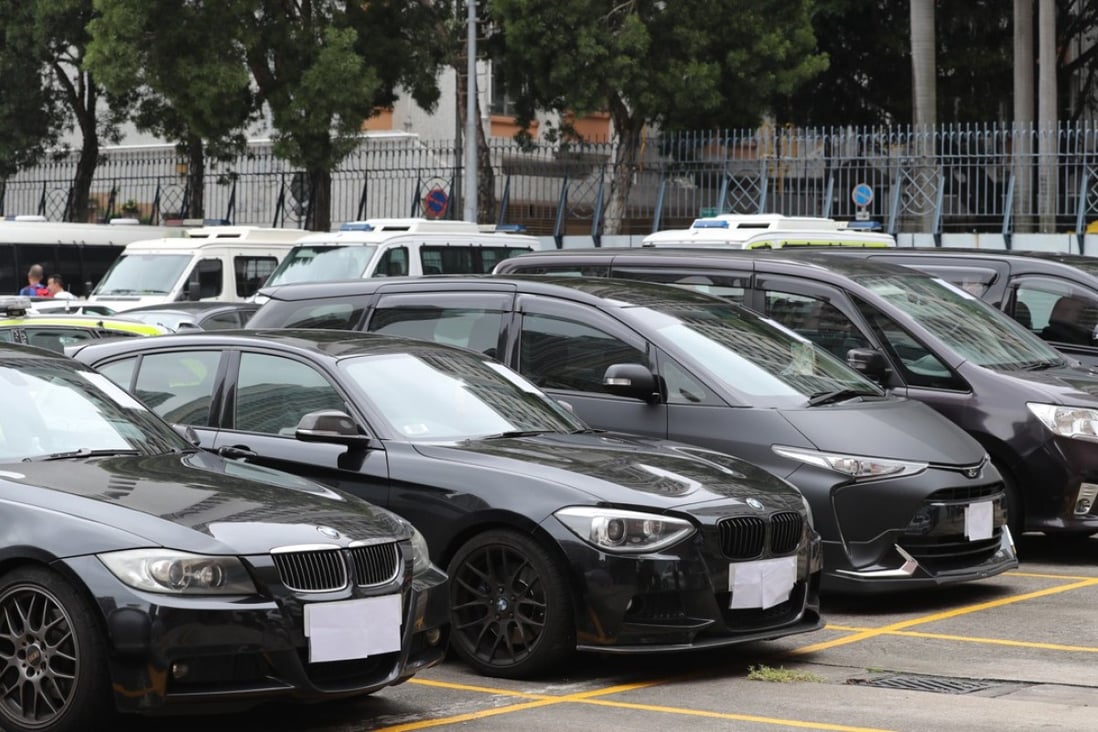Uber vehicles detained at the Sham Shui Po police station in Sham Shui Po. Hong Kong police arrested 22 Uber drivers in an undercover sting operation, the largest of its kind. Photo: Edward Wong