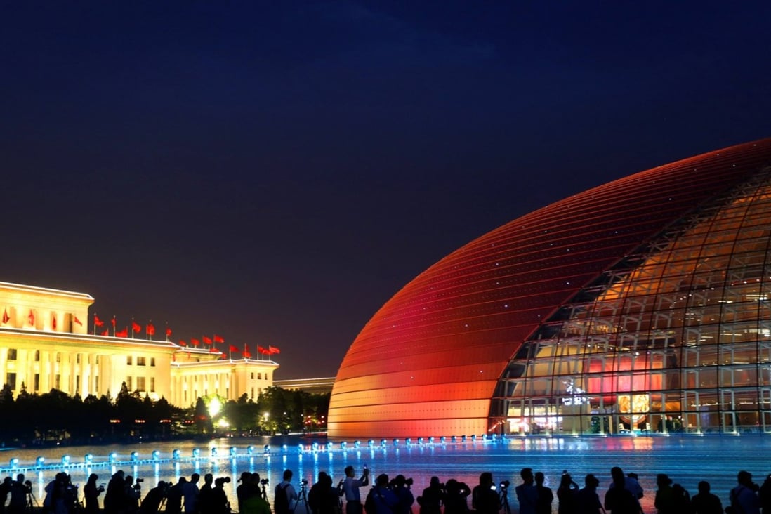 An illuminated Grand National Theatre draws admiring crowds ahead of the Belt and Road Forum in Beijing, on May 12. Western classical music and grand opera are integral parts of cultural life in Beijing and Shanghai. Photo: Reuters