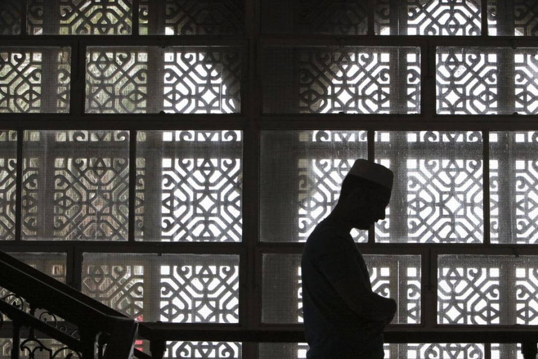A man prays at the Kowloon Mosque in Tsim Sha Tsui, on June 1. If terrorism did have something to do with Islam, “Islamic” terrorism would be a centuries-old problem. Photo: Felix Wong