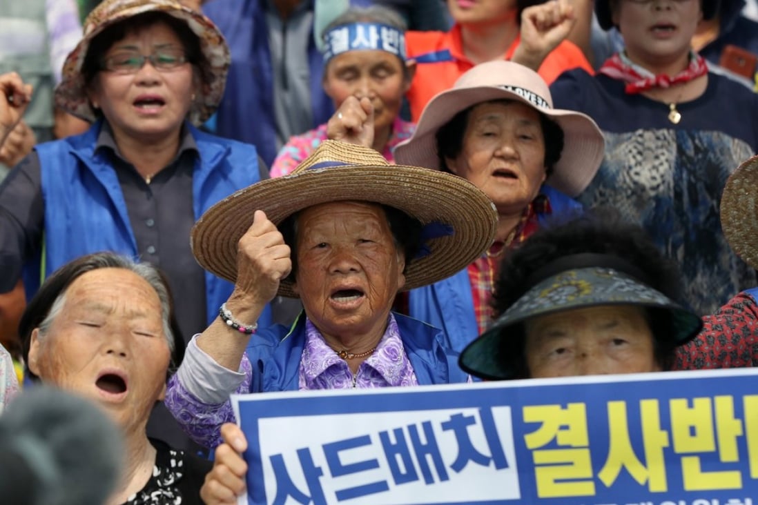 People rally against the deployment of a missile defence system close to a golf course in Seongju, South Korea. Photo: EPA