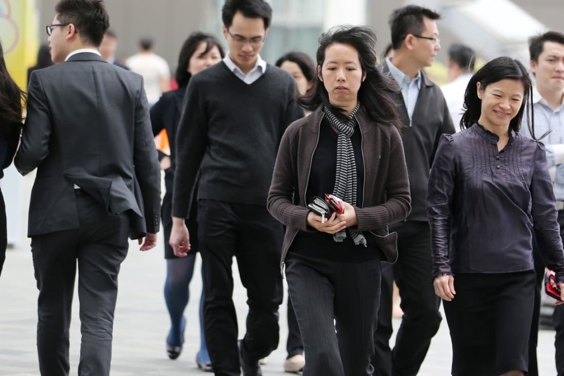 Office workers outside the government headquarters in Hong Kong. Studies in Japan and Canada show that closing the gender participation gap in the workforce could boost annual GDP by up to 13 per cent. Photo: Nora Tam