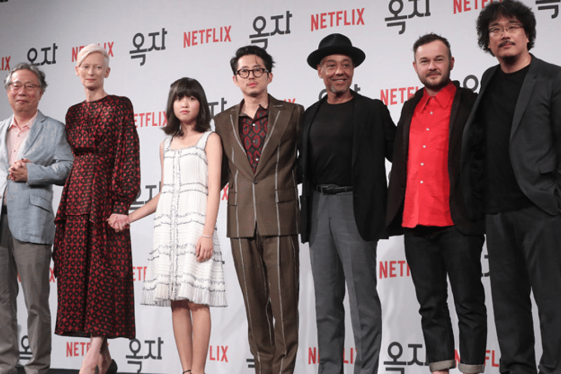 Actors of the film "Okja," directed by Bong Joon-ho, pose during a press conference at the Four Seasons Seoul, Wednesday. From left are Byun Hee-bong, Tilda Swinton, Ahn Seo-hyun, Steven Yeun, Giancarlo Esposito, Daniel Henshall and Bong. Photo: Yonhap