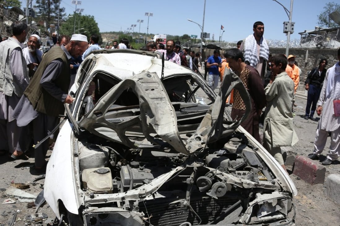 A crowd gathers at the site of a car bomb explosion in Kabul on May 31. Photo: Xinhua