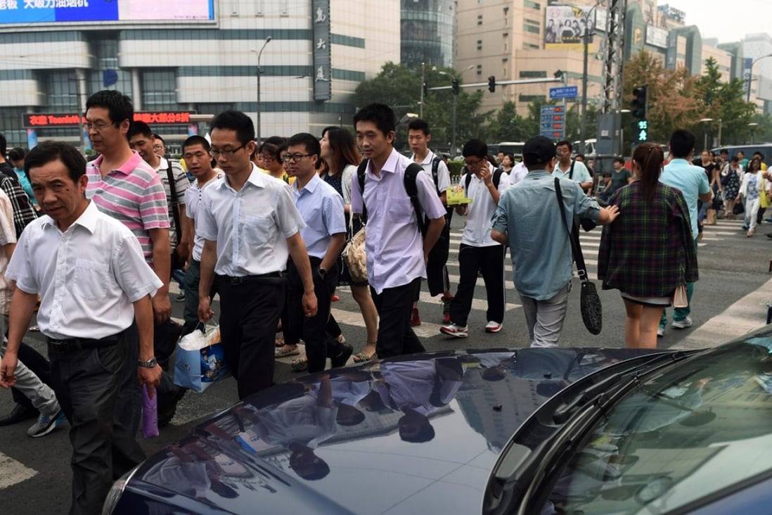 A file picture of pedestrians crossing legally on a green light in Beijing. Photo: AFP