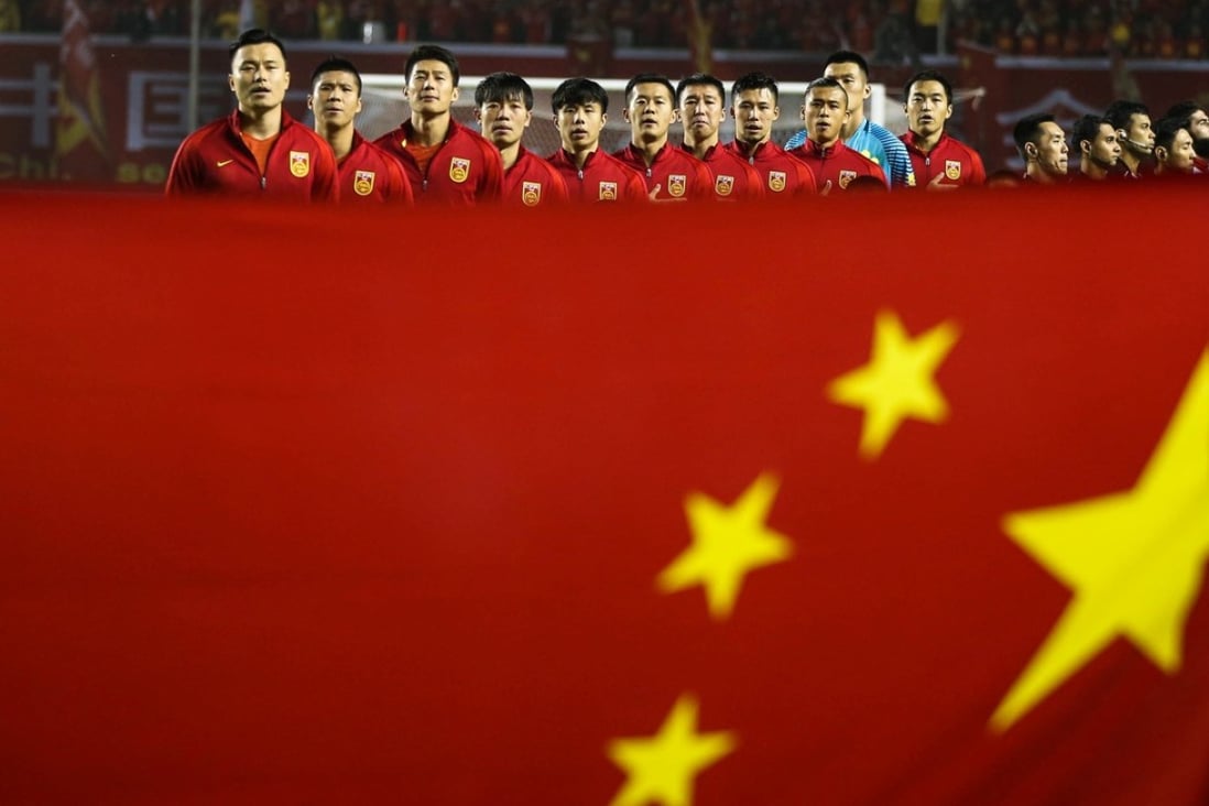 A file picture of China’s football team singing the national anthem before a match against Syria last year. Photo: Reuters