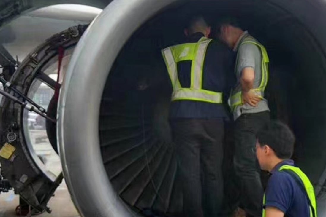 The China Southern Airlines plane engine is searched for the “lucky coins” thrown by an elderly passenger at Shanghai Pudong International Airport. Photo: Handout