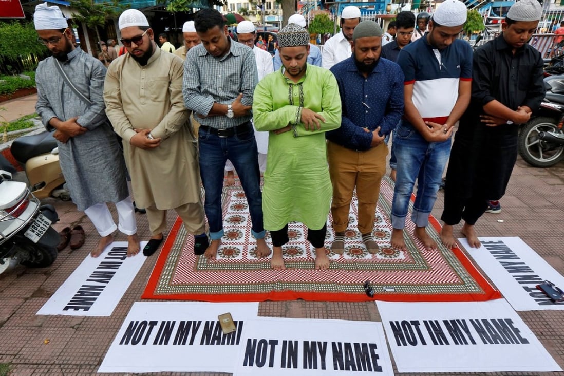 Muslims offer prayers in Kolkata as they take part in a protest against mob lynchings of Muslims who were accused of possessing beef. Photo: Reuters