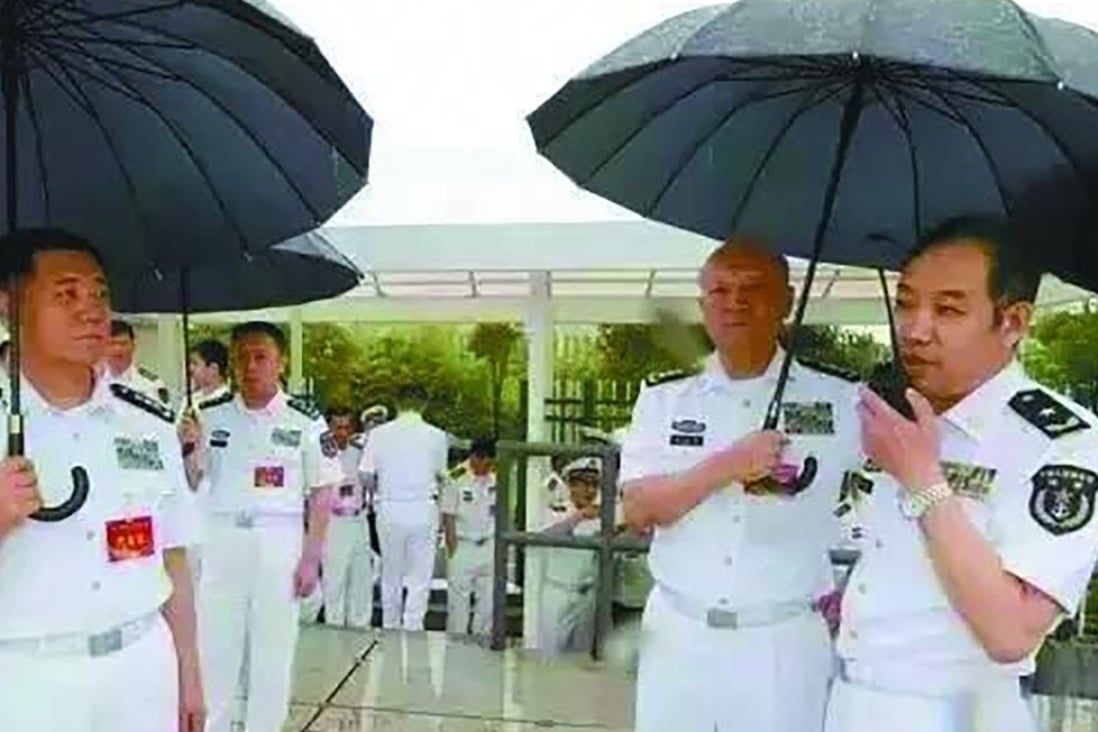 Admiral Wu Shengli (second right), then commander of the PLA Navy, holds an umbrella for Real Admiral Ma Weiming at the PLA Naval University of Engineering in Wuhan in June, 2016 . Photo: Handout