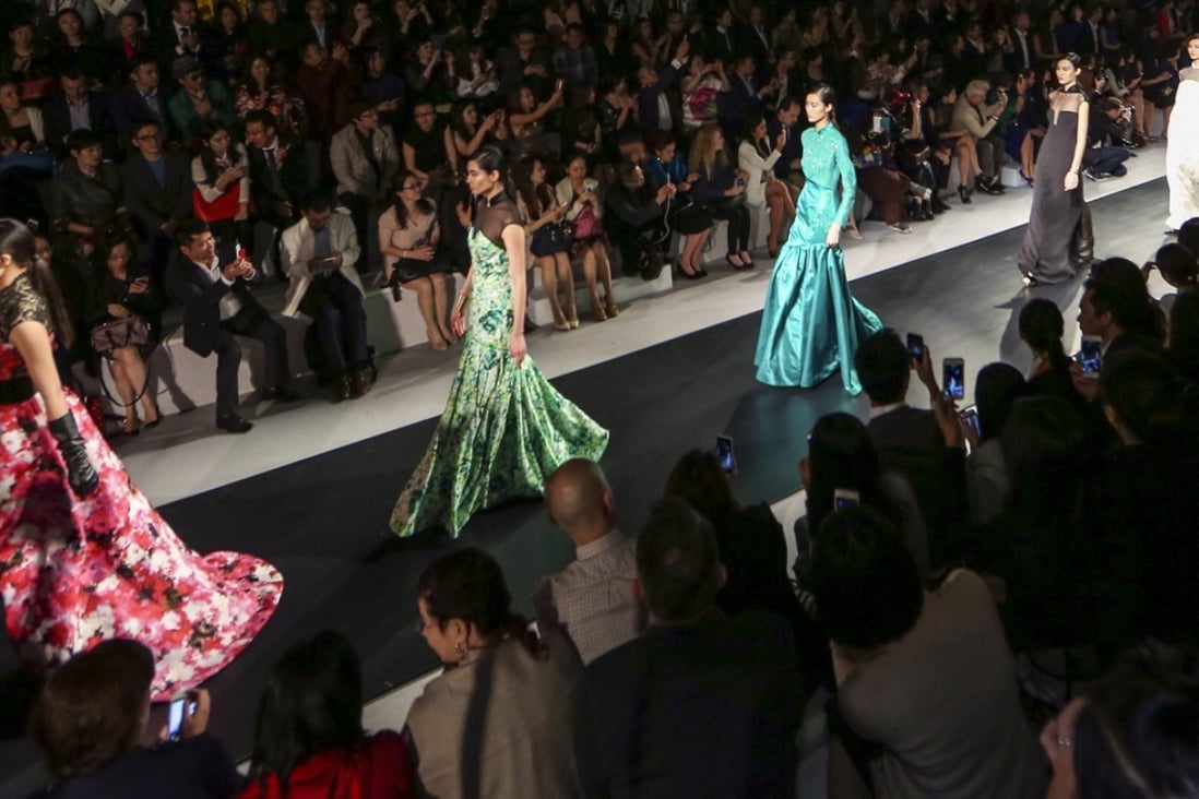 Models on the catwalk during Shanghai Tang's 20th anniversary celebration in Shanghai presenting it's spring/summer 2015 collection