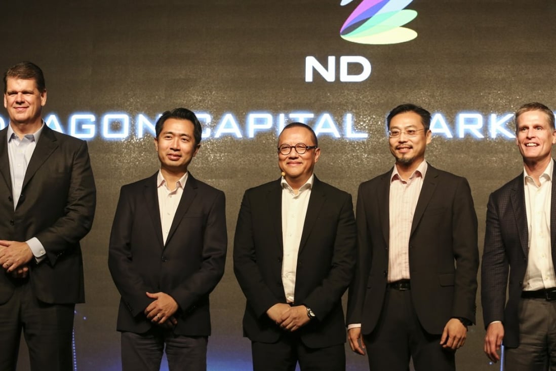 From left: Jumpstart chief executive officer David Lord; group chief financial officer Ben Yam; group vice chairman Simon Leung; Cherrypicks chief executive officer Jason Chiu; and Promethean chief executive officer Vin Riera at the media presentation of NetDragon Websoft on Tuesday. Photo: Jonathan Wong