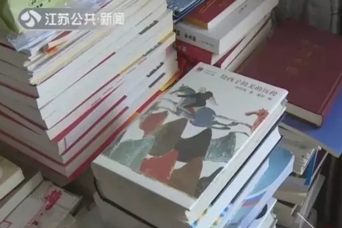 Some of the tens of thousands of books piled high in the couple’s home in Jiangsu province. Photo: Handout
