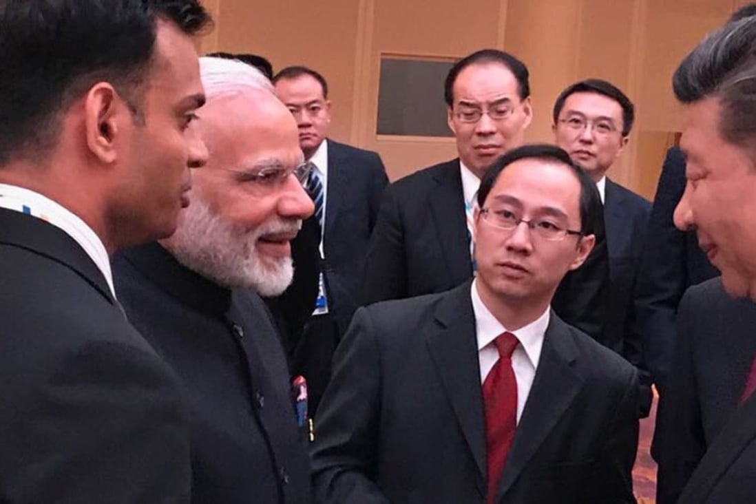 Narendra Modi (left) and Xi Jinping shake hands on the sidelines of the G20 summit in Hamburg. Photo: Handout
