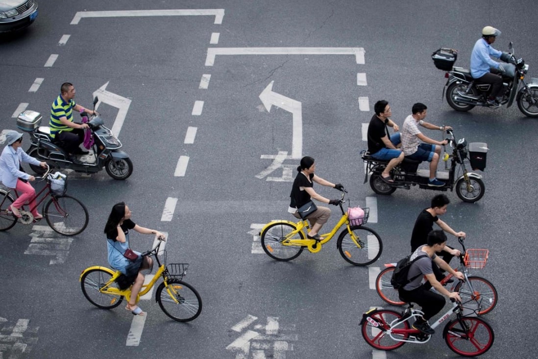 A group of bike sharers Shanghai. The authorities in Shanghai and Tianjin will impose regulations on the rapidly growing bike-sharing sector following mounting complaints over an accumulation of millions of the rentable two-wheelers on city streets. Photo: AFP