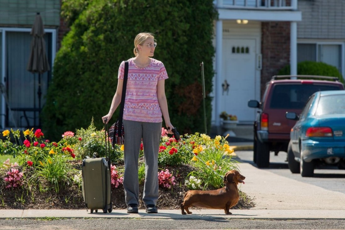 Greta Gerwig with the titular star of Wiener-Dog (category IIB), directed by Todd Solondz and also starring Keaton Nigel Cooke, Danny DeVito and Ellen Burstyn.