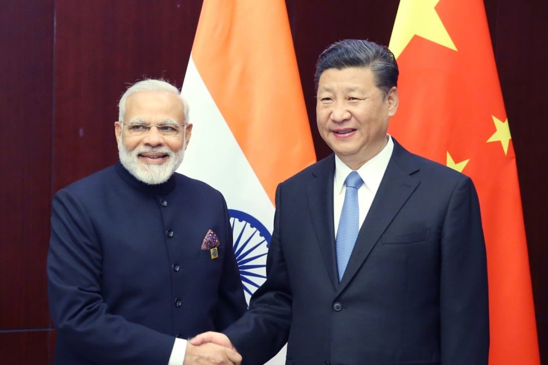 Chinese President Xi Jinping (right) meets with Indian Prime Minister Narendra Modi in Astana, Kazakhstan. Photo: Xinhua