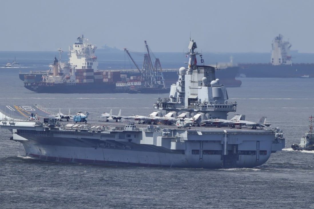 The Liaoning pictured leaving Hong Kong waters on Tuesday. Photo: Roy Issa