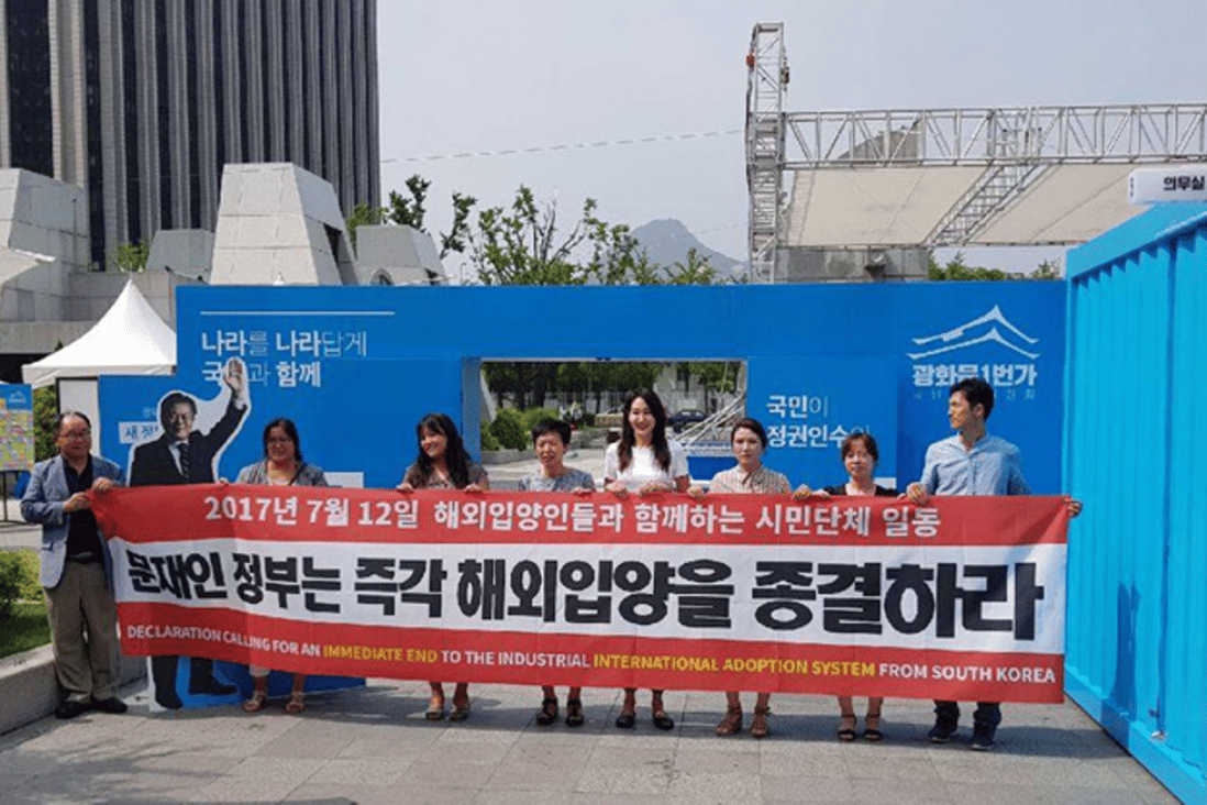 Members of adoptee-led organizations call for an immediate end to international adoption at Gwanghwamun Square, Wednesday. Photo: Kim Joon-young/Korea Times
