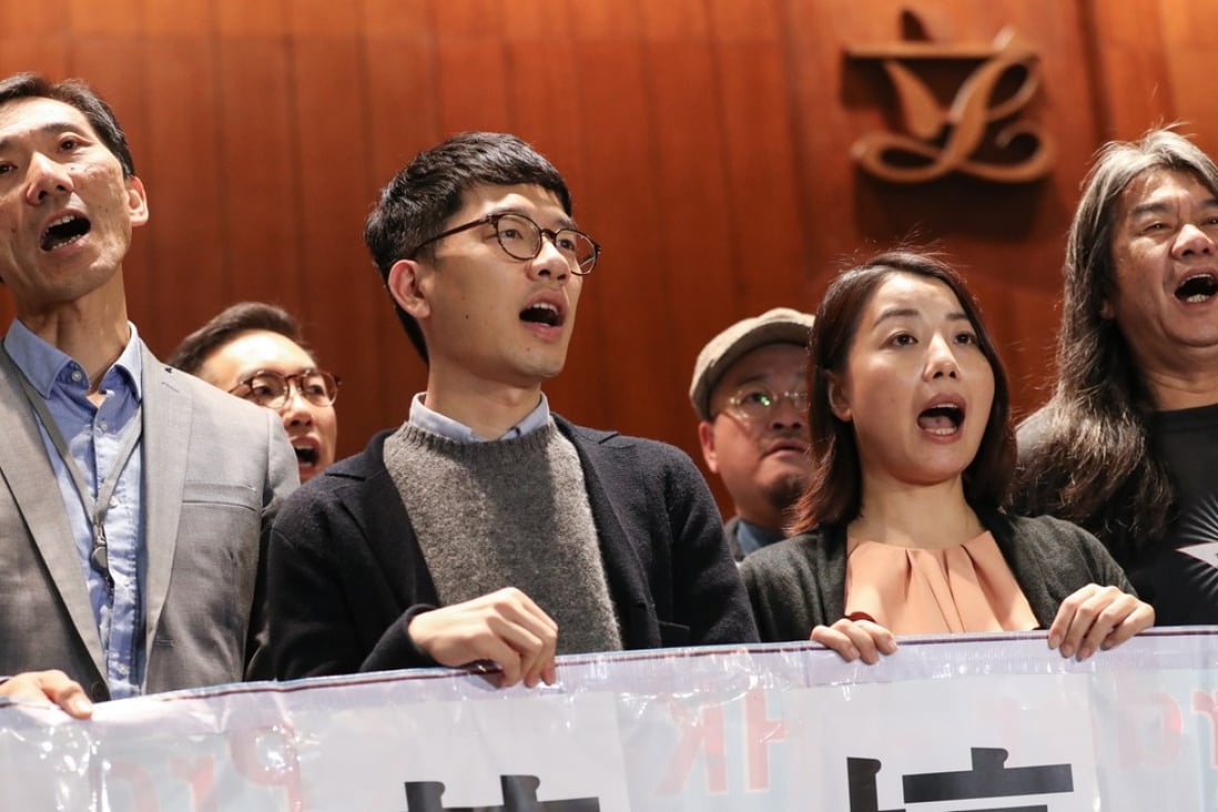 (Front, L-R) Disqualified lawmakers Edward Yiu Chung-yim, Nathan Law Kwun-chung, Lau Siu-lai and Leung Kwok-hung. Photo: Nora Tam