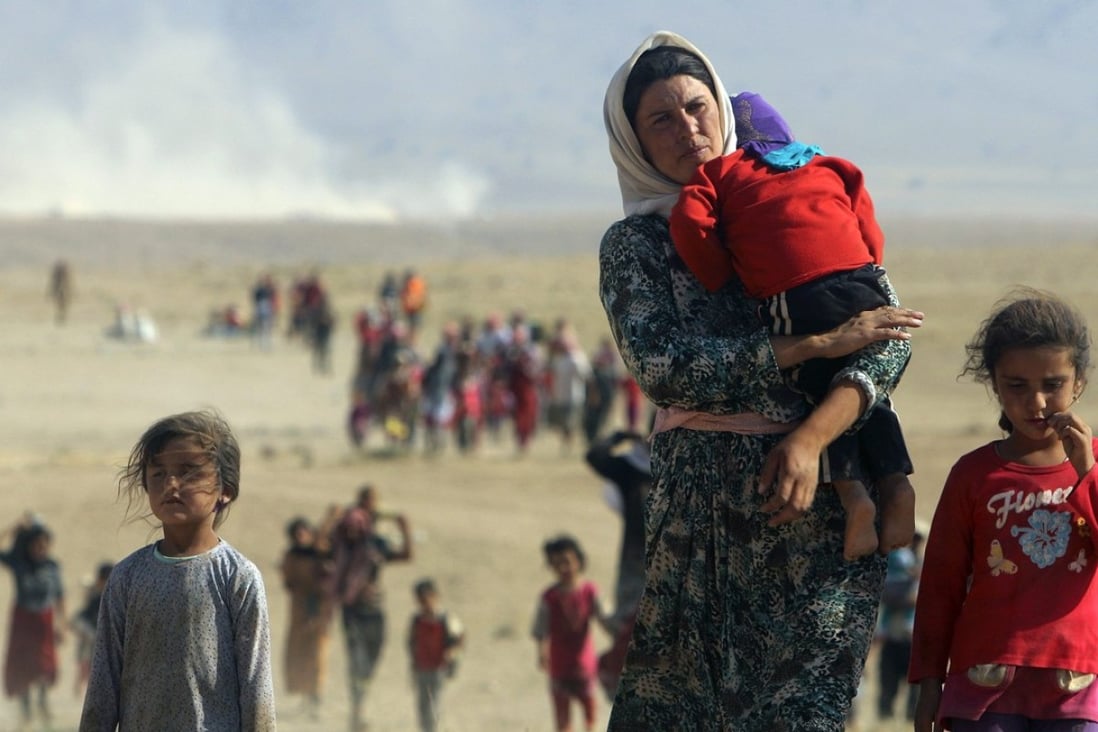 Yazidi refugees flee Islamic State forces in northern Iraq in August 2014. Photo: Reuters